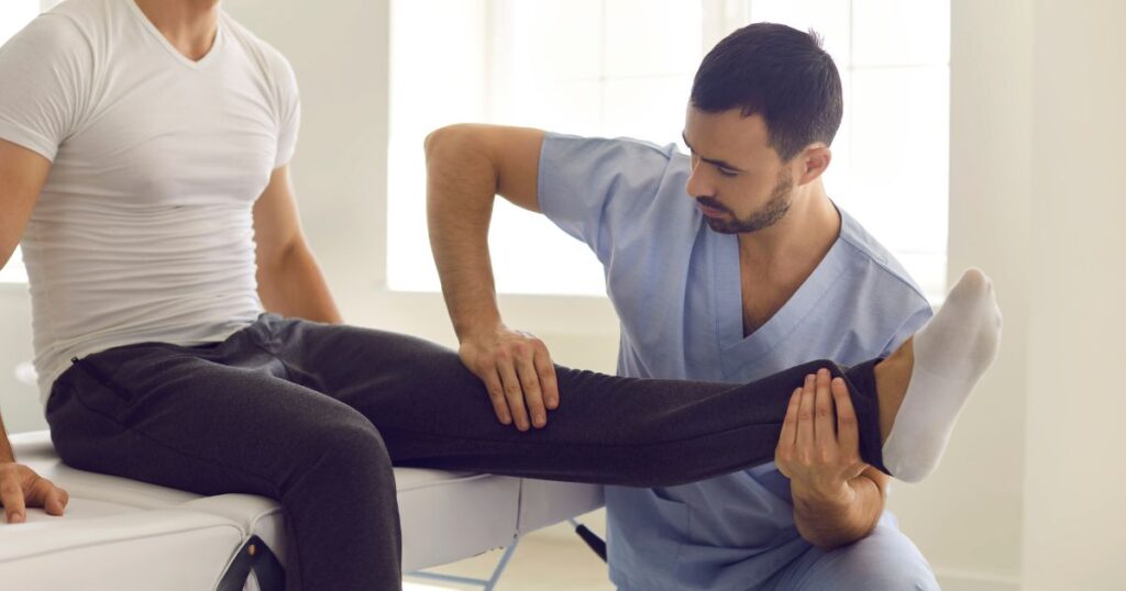 A physical therapist and patient during a session.