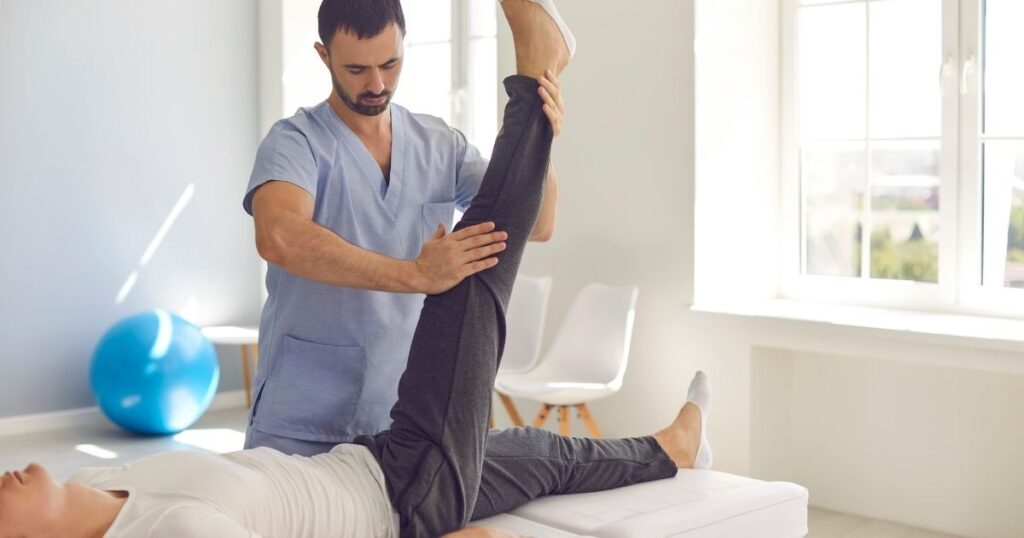 Physical therapist working with a patient.